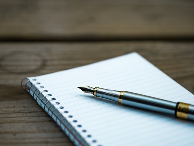 Image of a notebook and pen